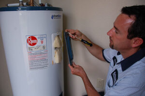 Plumber working on a water heater