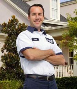 Rainaldi HVAC & Plumbing technician standing in front of a Winter Park, FL home